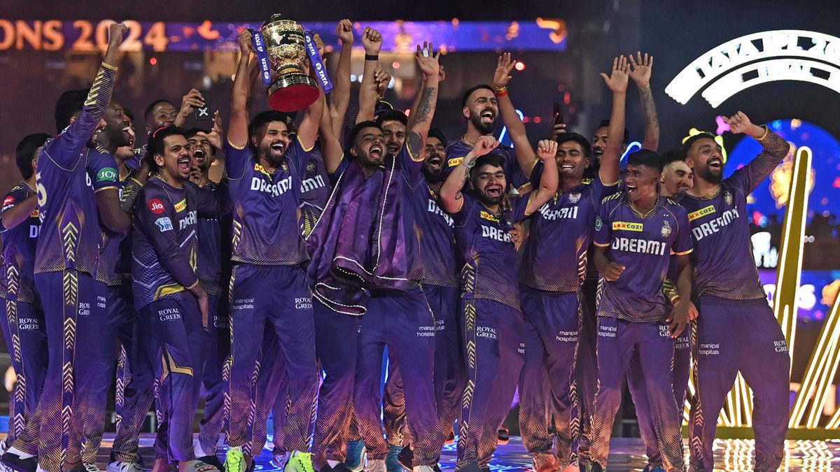 Kolkata Knight Riders' players celebrate with the trophy after winning the Indian Premier League (IPL) Twenty20 final cricket match against Sunrisers Hyderabad at the MA Chidambaram Stadium in Chennai on May 26, 2024