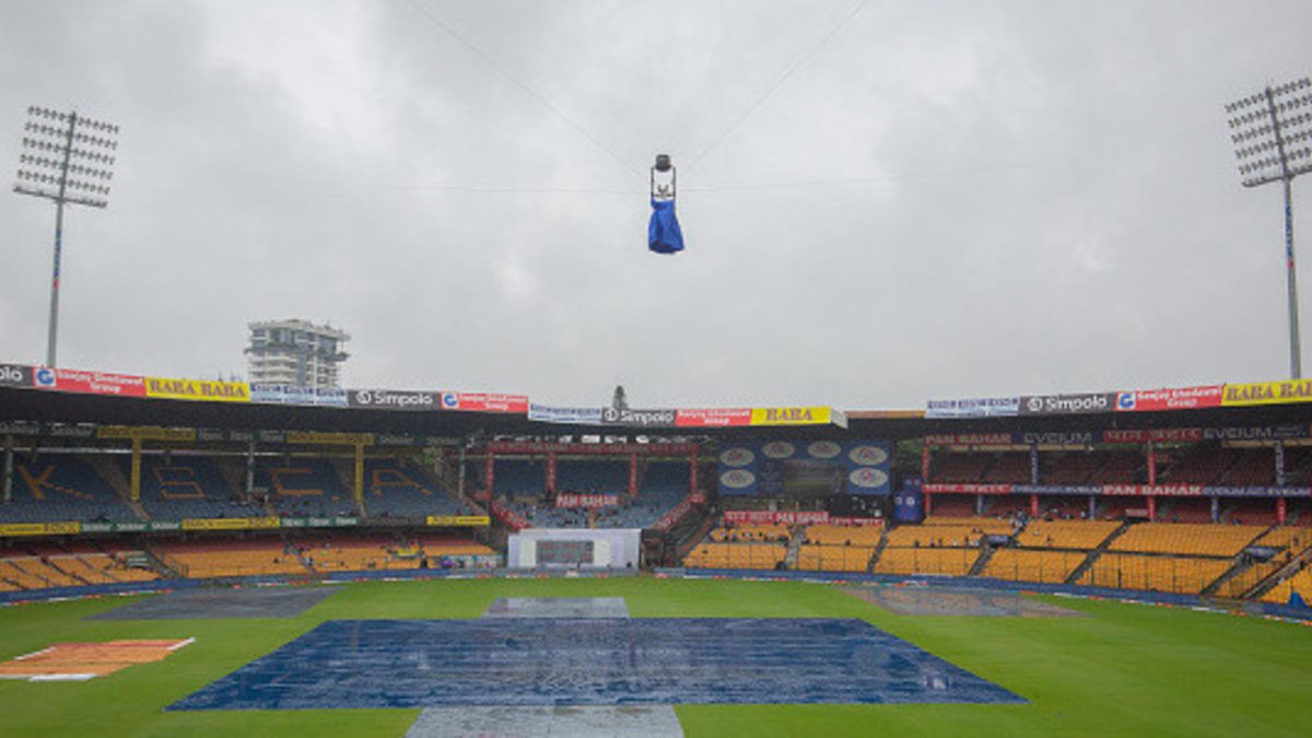 The playing area is seen covered with tarpaulin as rain delays the start of day one of the First Test match between India and New Zealand at M. Chinnaswamy Stadium on October 16, 2024 in Bengaluru, India