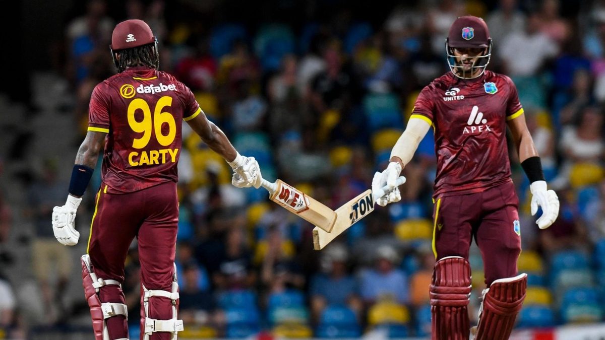 Brandon King and Keacy Carty touch bats during huge partnership against England